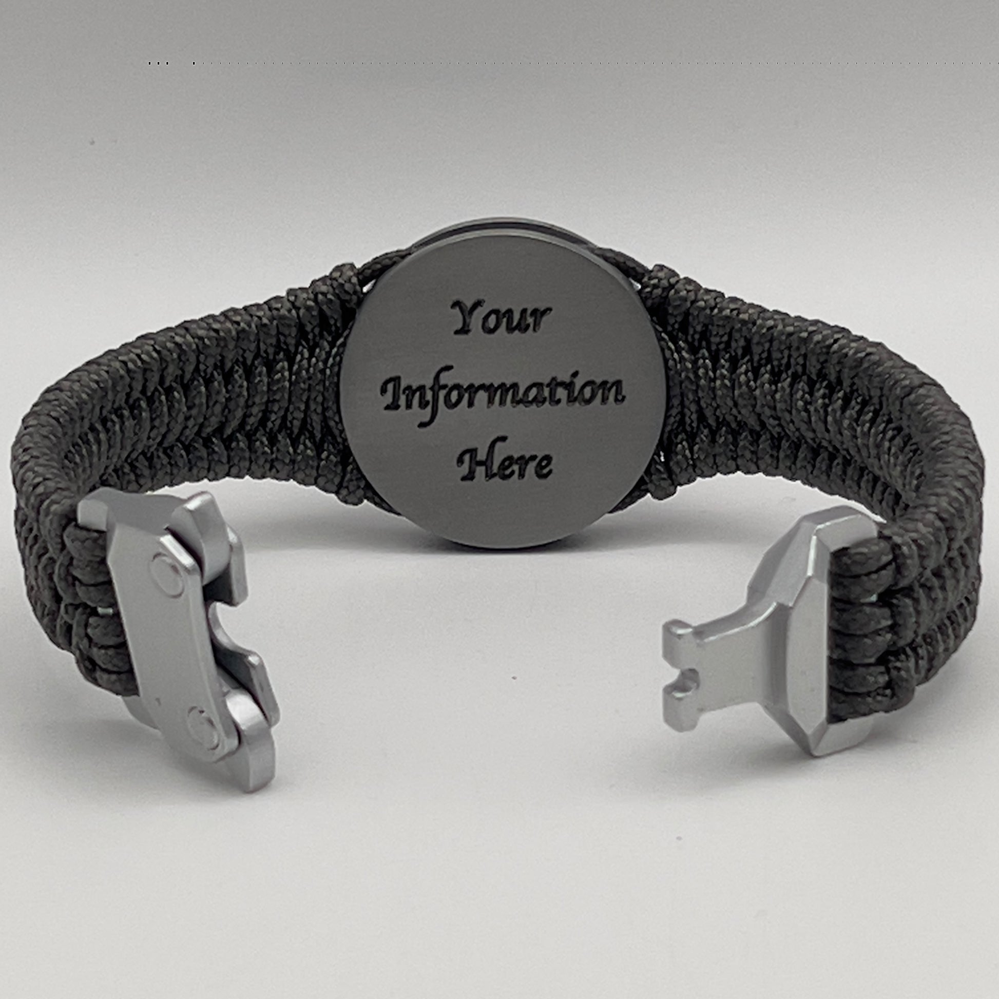 Thin, narrow, flexible and comfortable braided United States Marine Corps Iwo Jima bracelet featuring an antique silver plated Iwo Jima flag raising medallion, a silver Cobra style tactical buckle and woven with Charcoal Gray type-1 paracord.