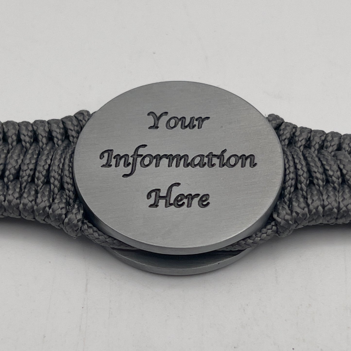 Thin, narrow, flexible and comfortable braided United States Marine Corps Iwo Jima bracelet featuring an antique silver plated UV painted Iwo Jima flag raising medallion, a silver Cobra style tactical buckle and woven with Charcoal Gray type-1 paracord.