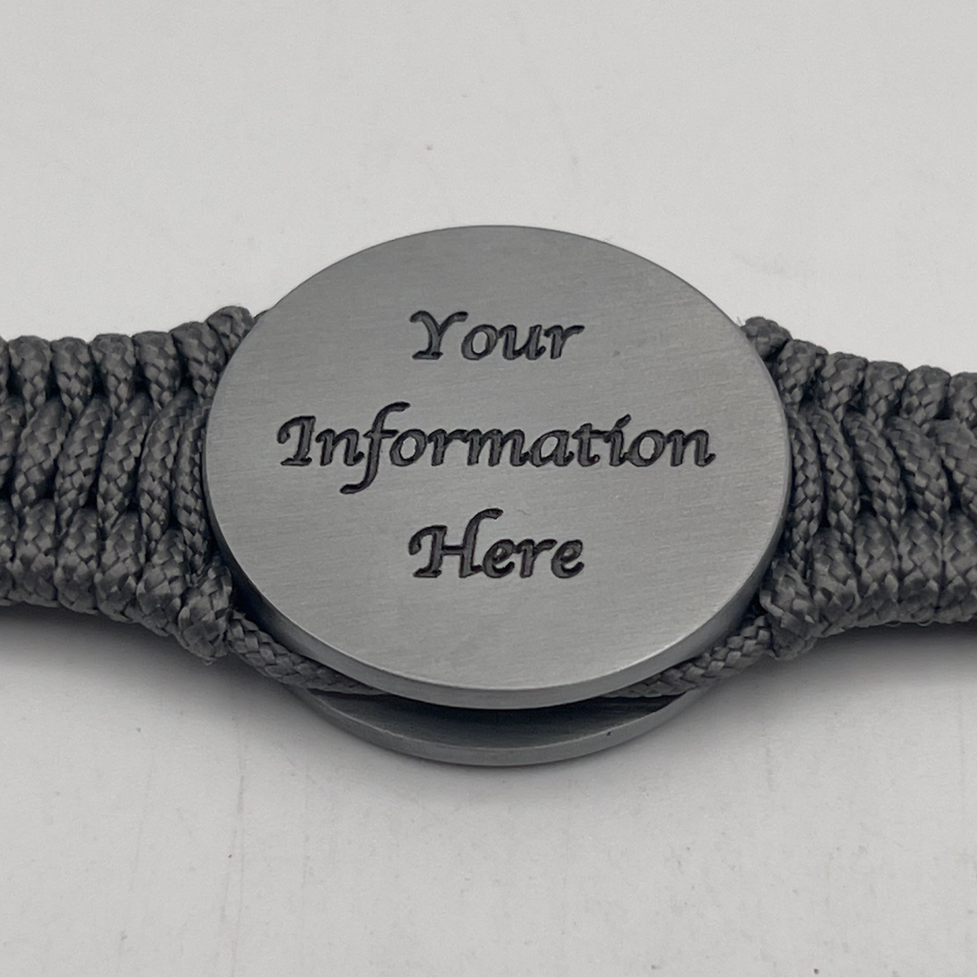 Thin, narrow, flexible and comfortable braided United States Marine Corps Iwo Jima bracelet featuring an antique silver plated UV painted Iwo Jima flag raising medallion, a silver Cobra style tactical buckle and woven with Charcoal Gray type-1 paracord.