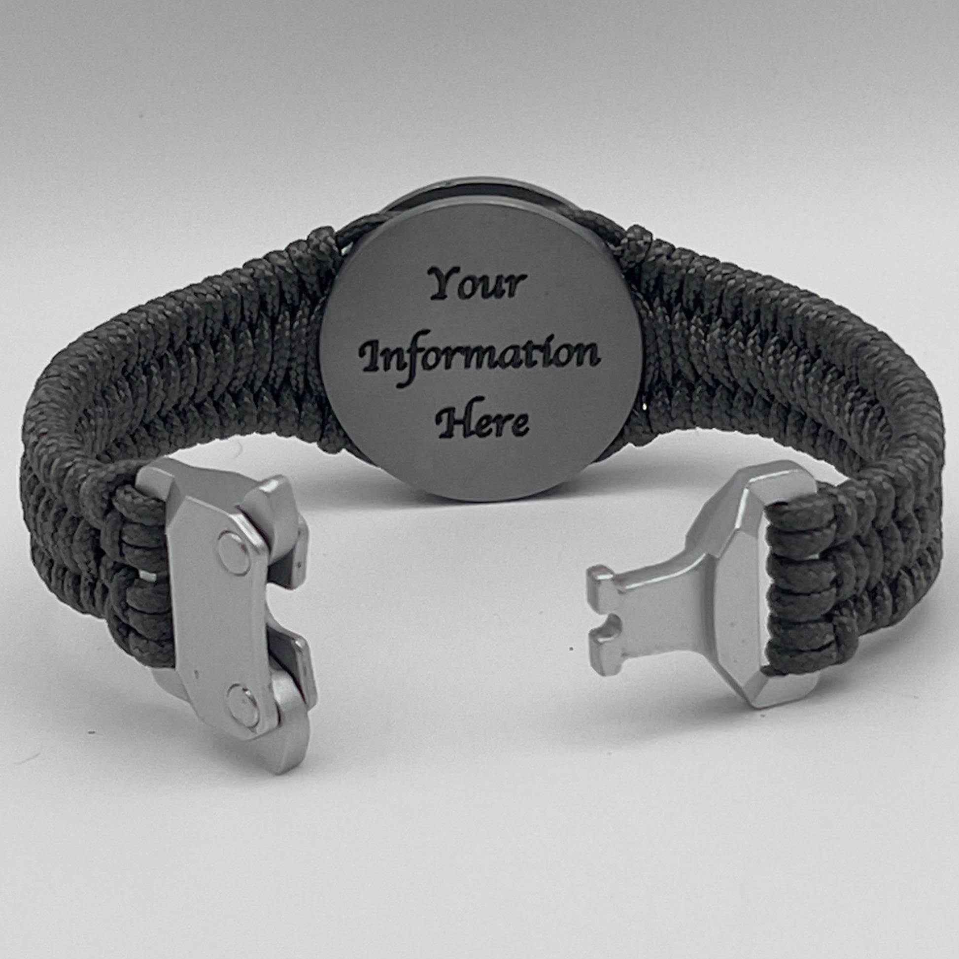 Thin, narrow, flexible and comfortable braided United States Marine Corps Iwo Jima bracelet featuring an antique silver plated UV painted Iwo Jima flag raising medallion, a silver Cobra style tactical buckle and woven with Charcoal Gray type-1 paracord.