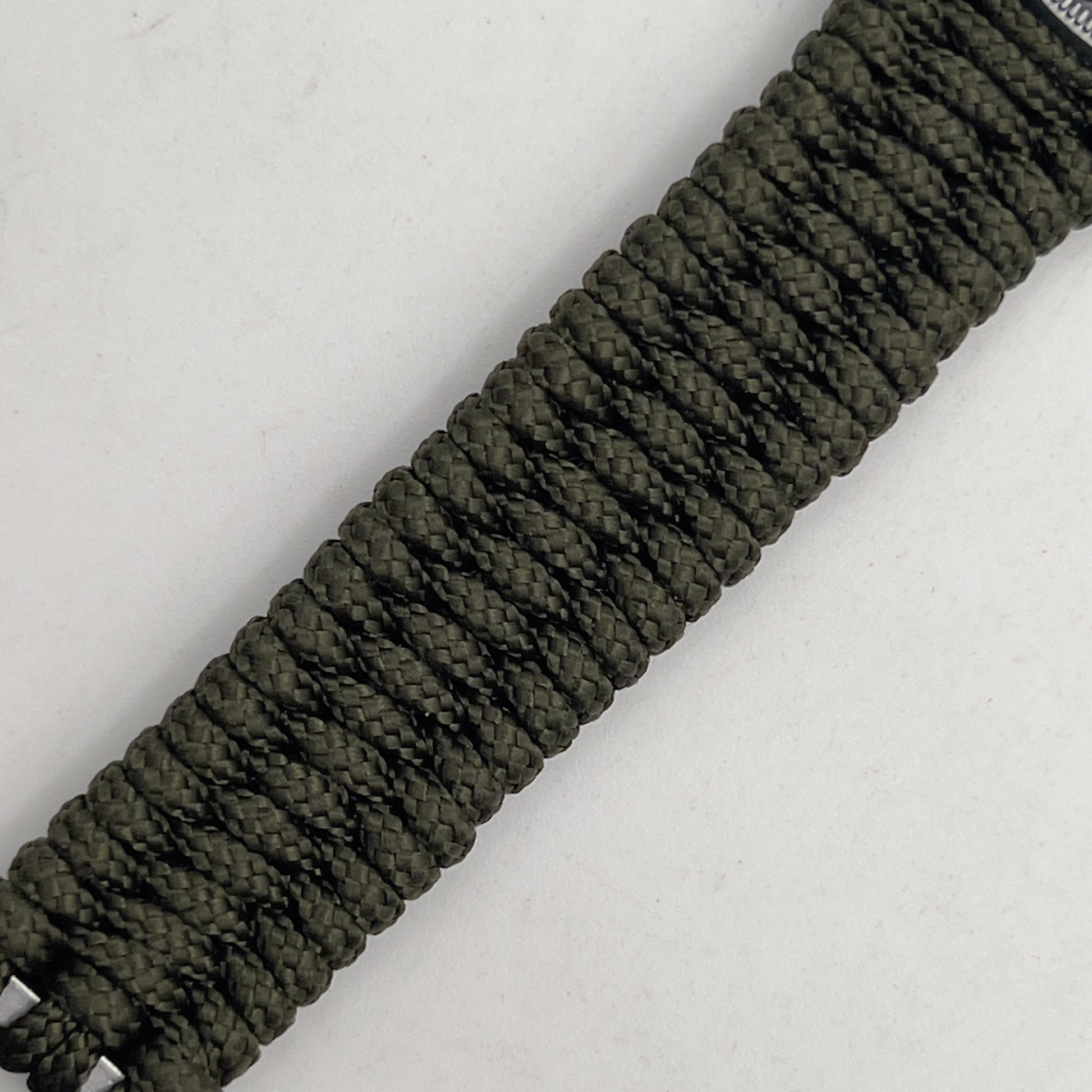 Thin, narrow, flexible and comfortable braided United States Marine Corps Iwo Jima bracelet featuring an antique silver plated UV painted Iwo Jima flag raising medallion, a silver Cobra style tactical buckle and woven with Olive Drab type-1 paracord.