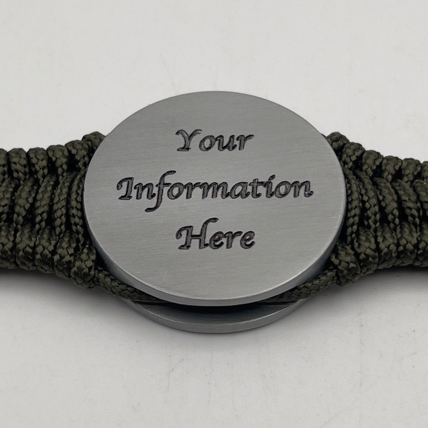 Thin, narrow, flexible and comfortable braided United States Marine Corps Iwo Jima bracelet featuring an antique silver plated UV painted Iwo Jima flag raising medallion, a silver Cobra style tactical buckle and woven with Olive Drab type-1 paracord.