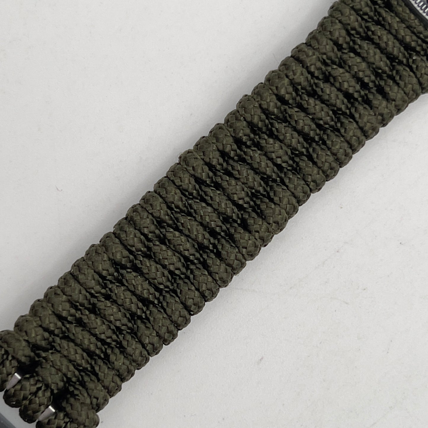 Thin, narrow, flexible and comfortable braided United States Marine Corps Iwo Jima bracelet featuring an antique silver plated UV painted Iwo Jima flag raising medallion, a silver Cobra style tactical buckle and woven with Olive Drab type-1 paracord.