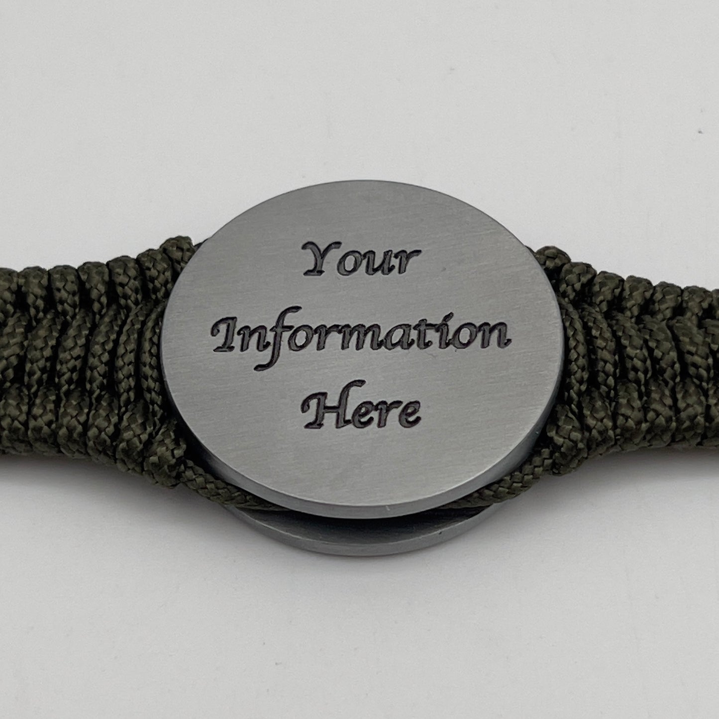 Thin, narrow, flexible and comfortable braided United States Marine Corps Iwo Jima bracelet featuring an antique silver plated UV painted Iwo Jima flag raising medallion, a silver Cobra style tactical buckle and woven with Olive Drab type-1 paracord.
