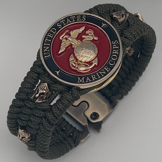 Thin, medium width, flexible and comfortable braided United States Marine Corps bracelet featuring a 24K gold plated USMC officer Eagle Globe and Anchor medallion, six Spartan micro beads, a gold Cobra style tactical buckle and woven with Olive Drab Type-1 paracord.