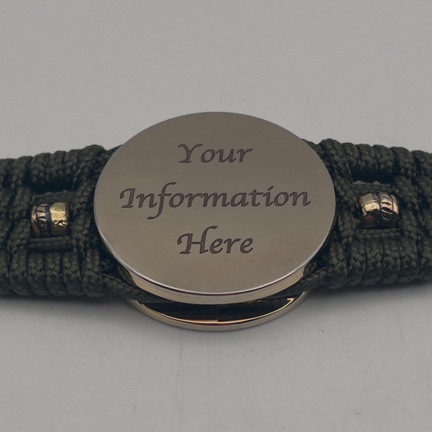 Thin, medium width, flexible and comfortable braided United States Marine Corps bracelet featuring a 24K gold plated USMC officer Eagle Globe and Anchor medallion, six Spartan micro beads, a gold Cobra style tactical buckle and woven with Olive Drab Type-1 paracord.