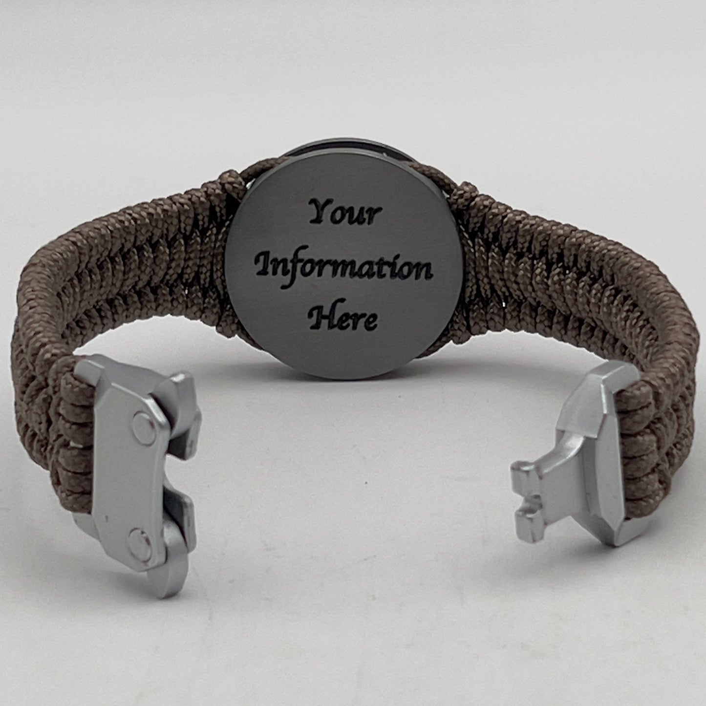 Thin, narrow, flexible and comfortable braided United States Marine Corps Iwo Jima bracelet featuring an antique silver plated Iwo Jima flag raising medallion, a silver Cobra style tactical buckle and woven with tan type-1 paracord.