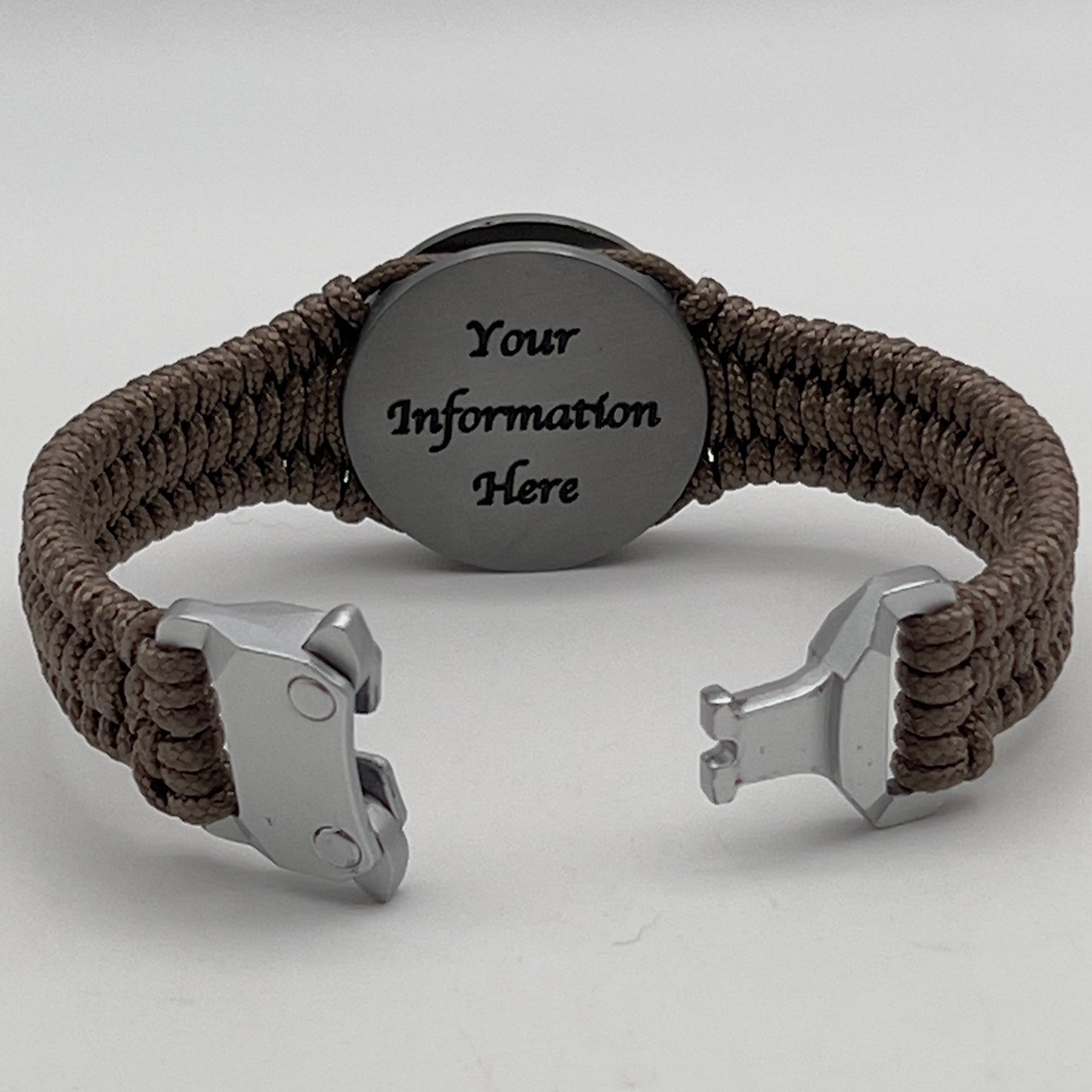 Thin, narrow, flexible and comfortable braided United States Marine Corps Iwo Jima bracelet featuring an antique silver plated UV painted Iwo Jima flag raising medallion, a silver Cobra style tactical buckle and woven with tan type-1 paracord.