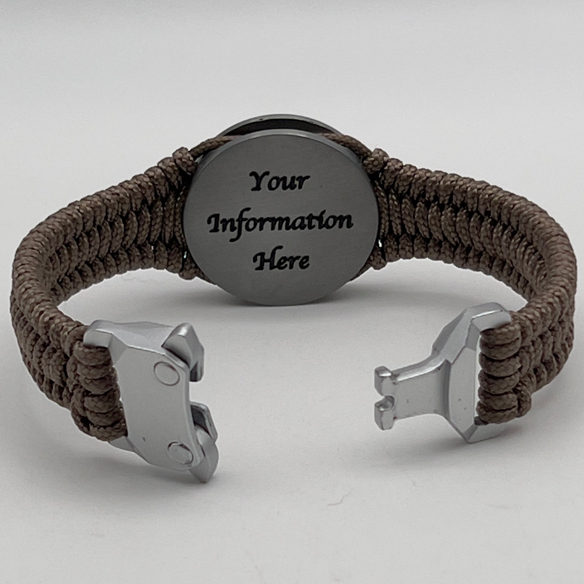 Thin, narrow, flexible and comfortable braided United States Marine Corps Iwo Jima bracelet featuring an antique silver plated UV painted Iwo Jima flag raising medallion, a silver Cobra style tactical buckle and woven with tan type-1 paracord.