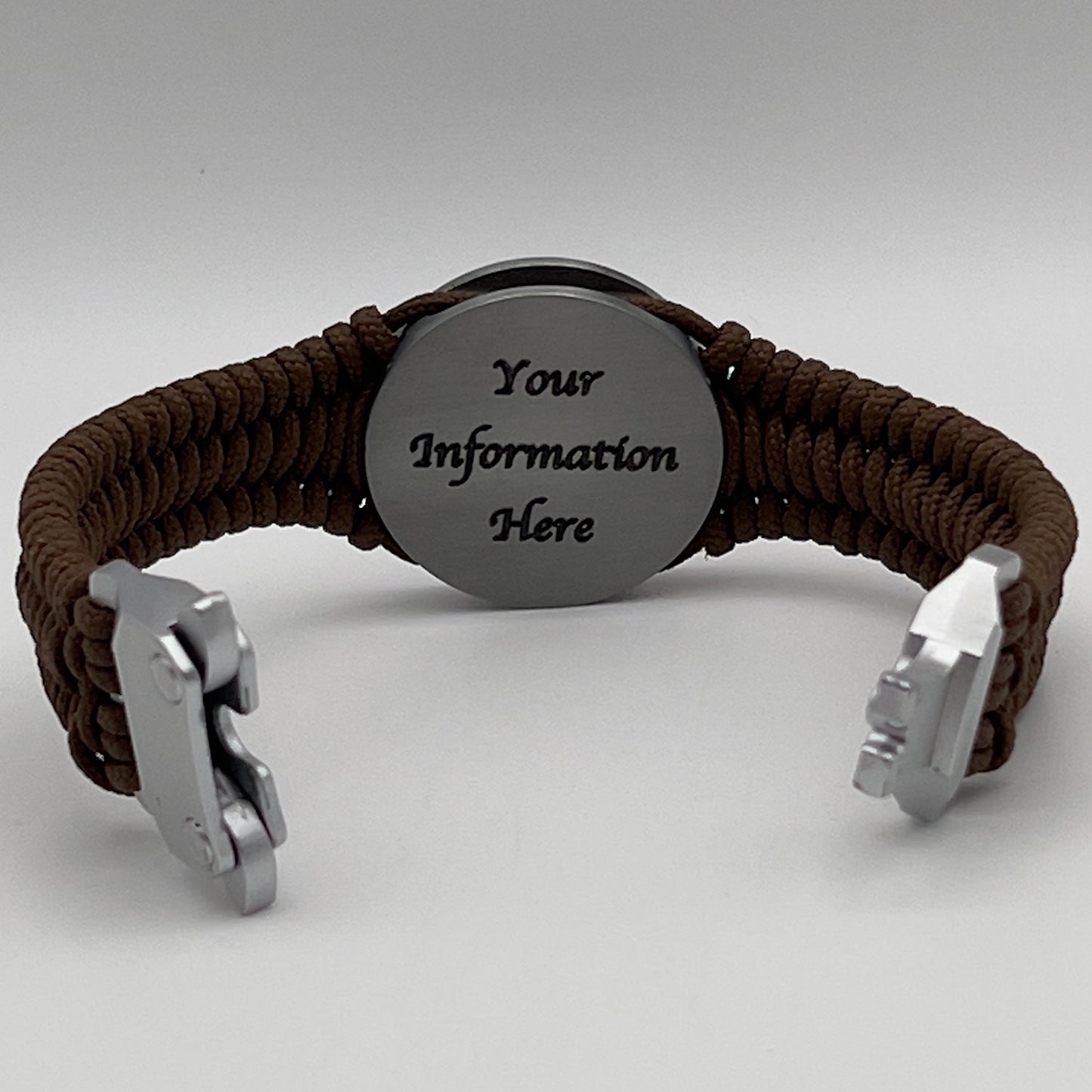 Thin, narrow, flexible and comfortable braided United States Marine Corps Iwo Jima bracelet featuring an antique silver plated Iwo Jima flag raising medallion, a silver Cobra style tactical buckle and woven with Coyote Brown type-1 paracord.