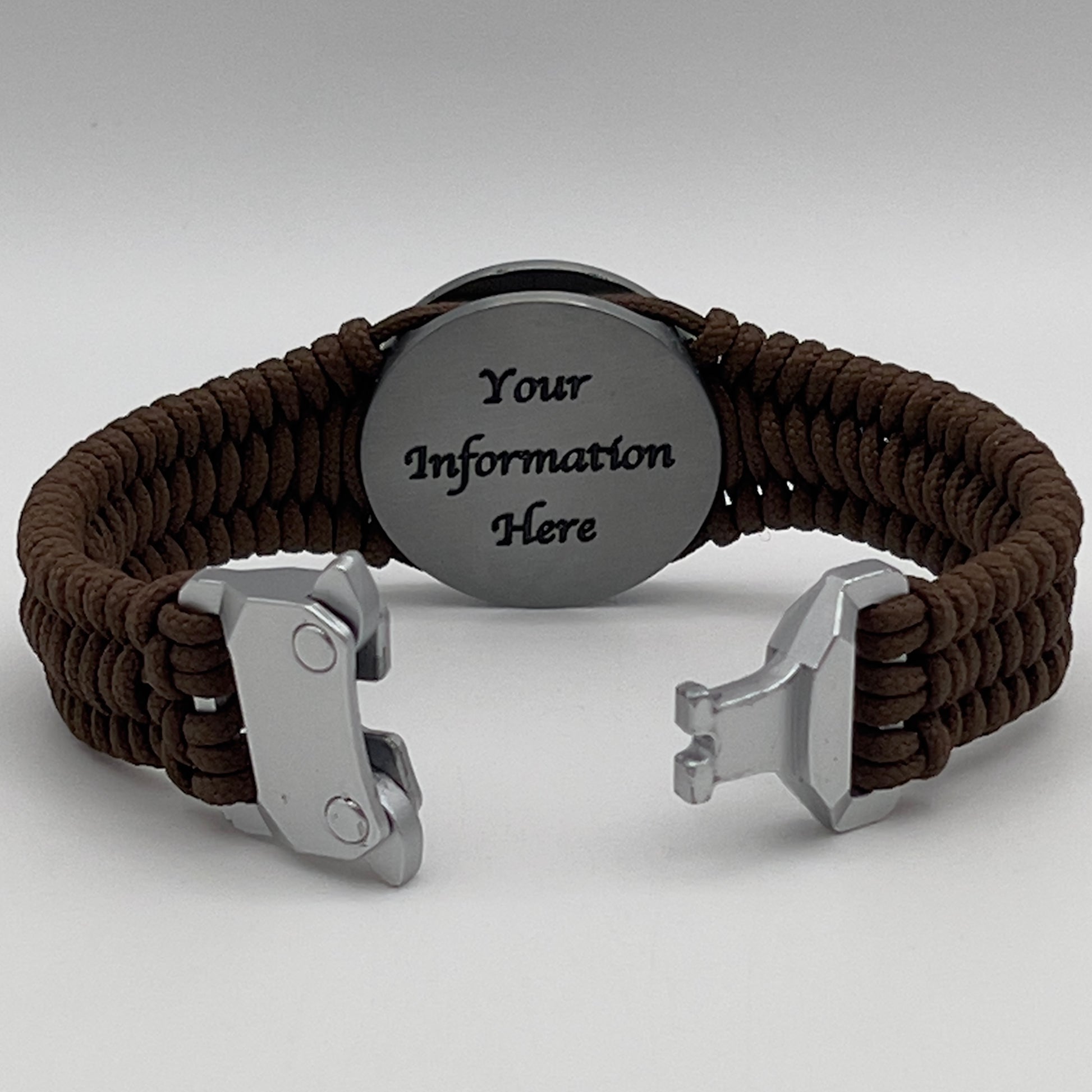 Thin, narrow, flexible and comfortable braided United States Marine Corps Iwo Jima bracelet featuring an antique silver plated UV painted Iwo Jima flag raising medallion, a silver Cobra style tactical buckle and woven with Coyote Brown type-1 paracord.
