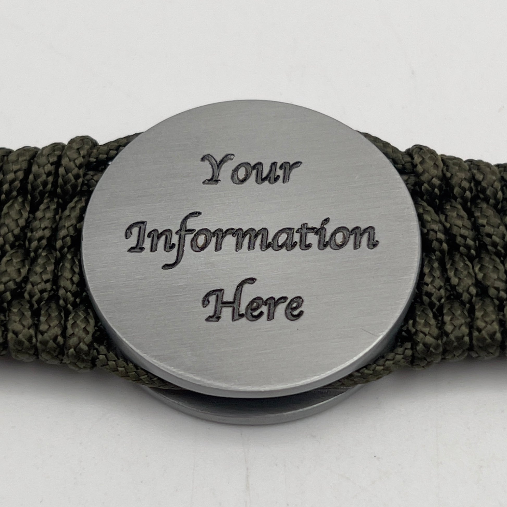 Thin, wide, flexible and comfortable braided United States Marine Corps Iwo Jima bracelet featuring an antique silver plated Iwo Jima flag raising medallion, a silver Cobra style tactical buckle and woven with olive drab type-1 paracord.
