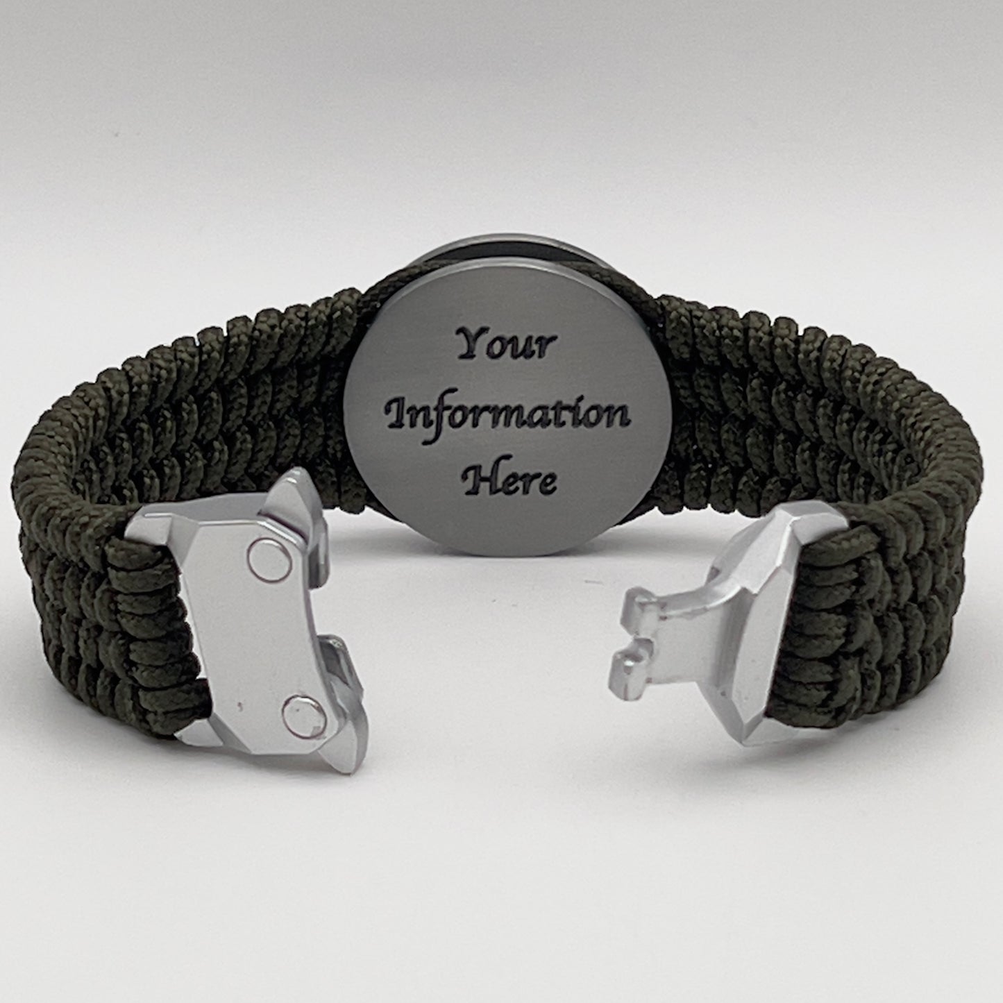 Thin, wide, flexible and comfortable braided United States Marine Corps Iwo Jima bracelet featuring an antique silver plated Iwo Jima flag raising medallion, a silver Cobra style tactical buckle and woven with olive drab type-1 paracord.