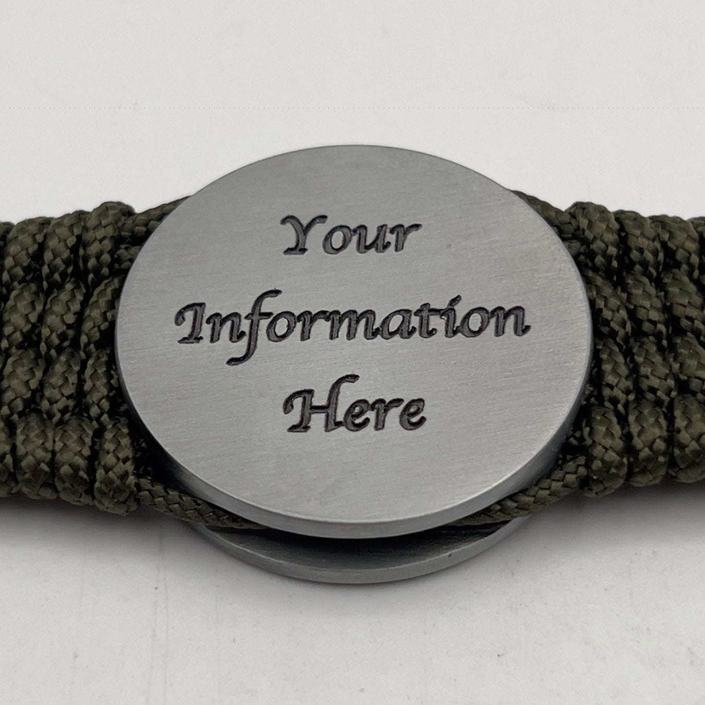 Thin, wide, flexible and comfortable braided United States Marine Corps Iwo Jima bracelet featuring an antique silver plated UV painted Iwo Jima flag raising medallion, a silver Cobra style tactical buckle and woven with olive drab Type-1 paracord.