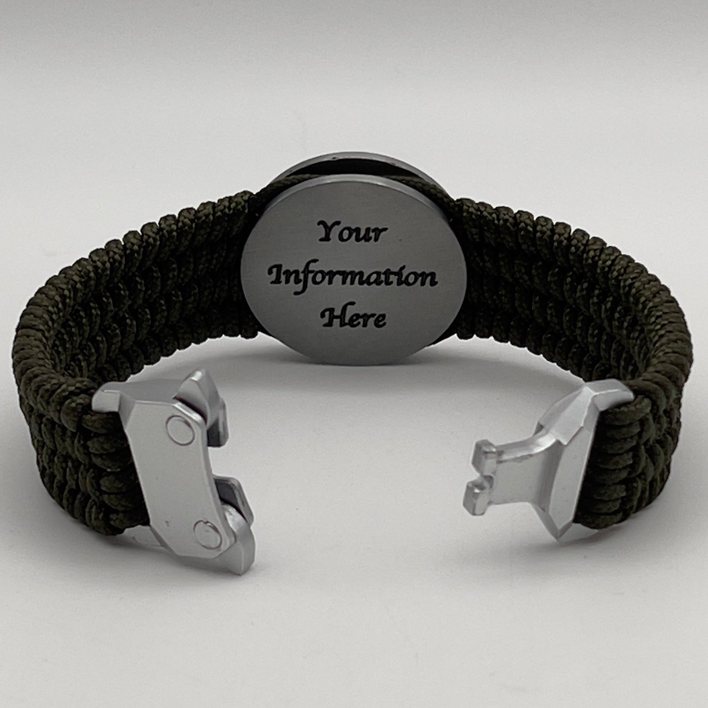 Thin, wide, flexible and comfortable braided United States Marine Corps Iwo Jima bracelet featuring an antique silver plated UV painted Iwo Jima flag raising medallion, a silver Cobra style tactical buckle and woven with olive drab Type-1 paracord.