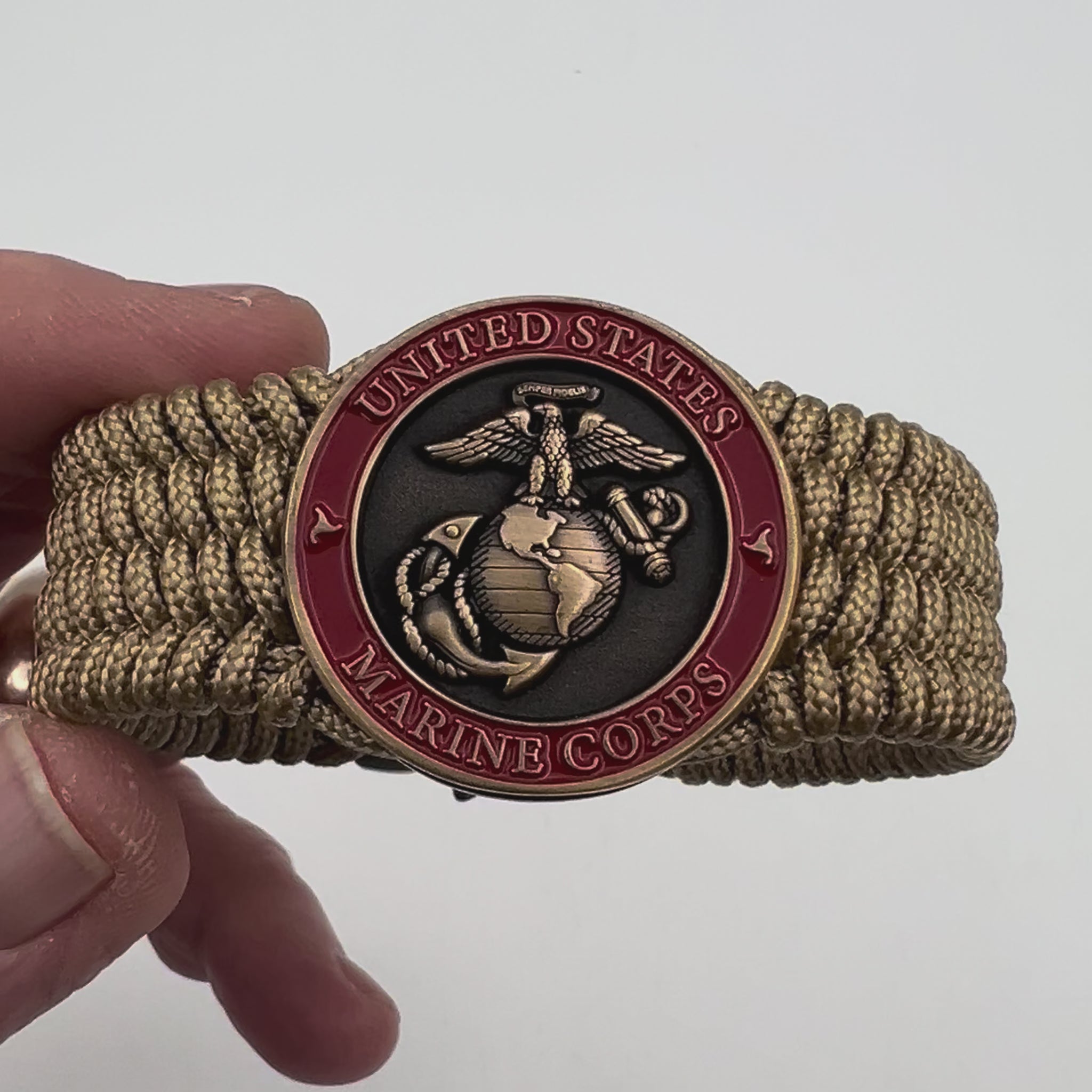 Thin, wide, flexible and comfortable braided United States Marine Corps bracelet featuring a 24K antique gold plated USMC Eagle Globe and Anchor medallion, a gold Cobra style tactical buckle and woven with gold Type-1 paracord.